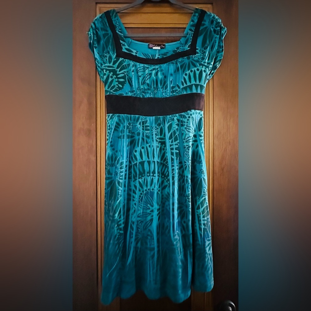 Teal Patterned Dress with Ruched Bodice, Square Neckline, and Striking Trim
